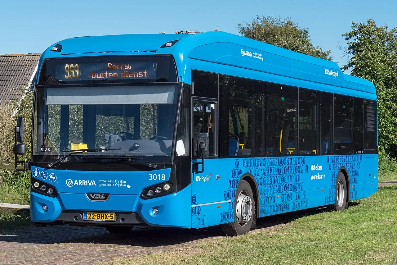 A modern electric bus operated by Arriva Fryslân in Nes, Ameland, showcasing sustainable urban transportation.