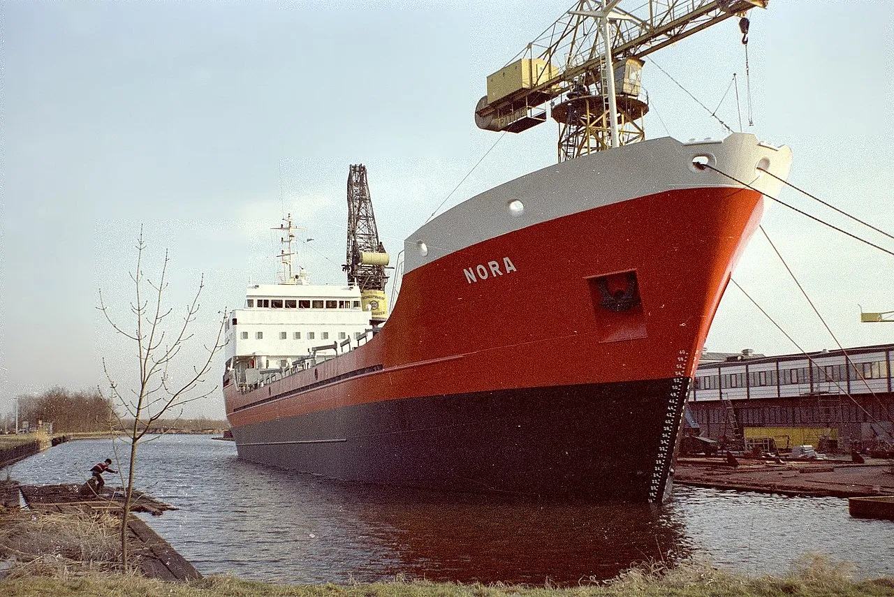 The MV Nora is being fitted out at the shipyard in Waterhuizen, Netherlands, during its construction phase in March 1982.