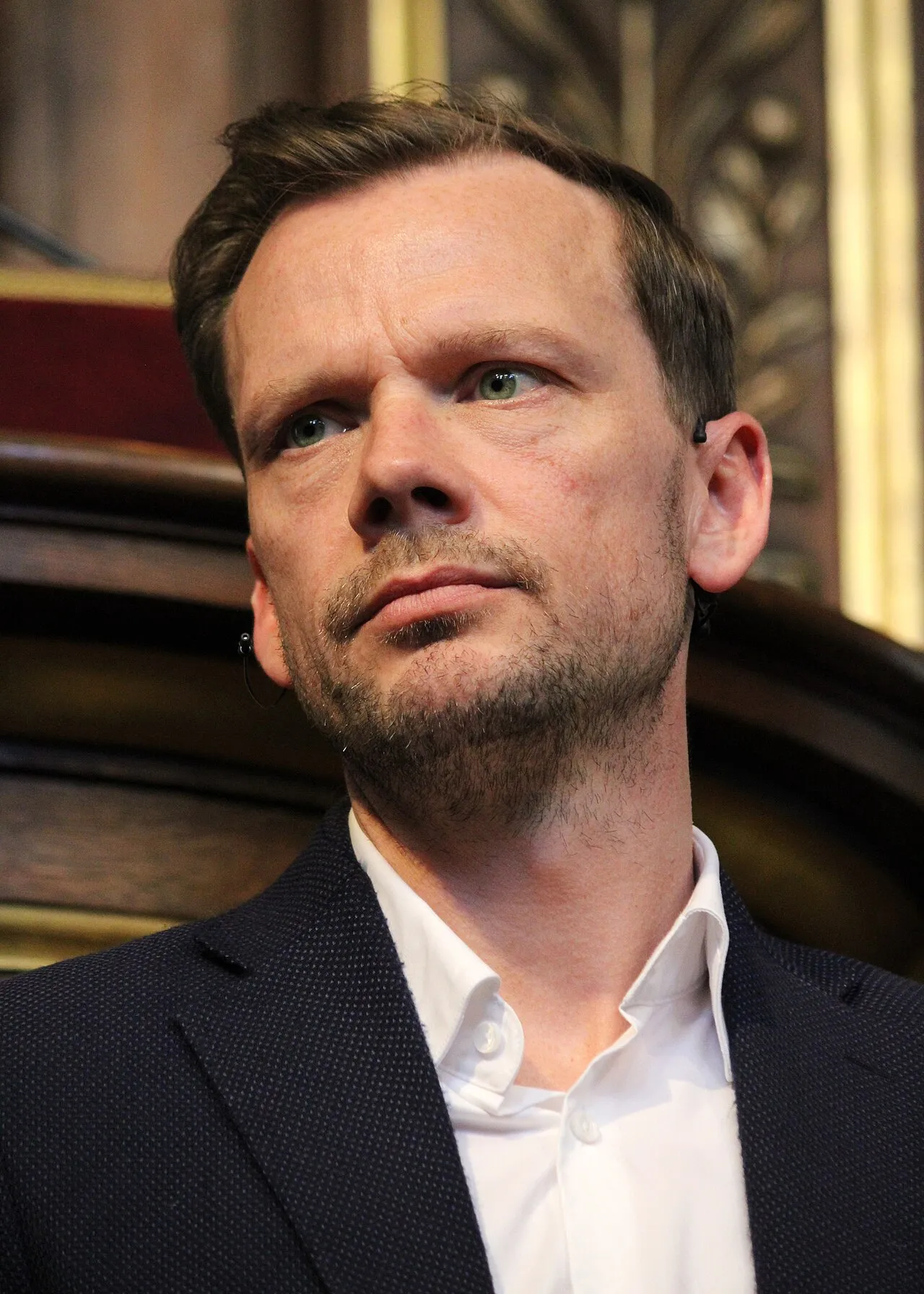 Peter Hummelgaard taler under en politisk debat med tilhørere i Festsalen i København. Billedet er taget i forbindelse med en debat ved Københavns Universitet.